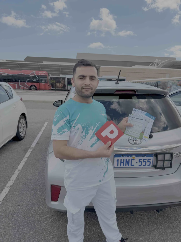 Hashmat with P plates after passing the driving test at Joondalup