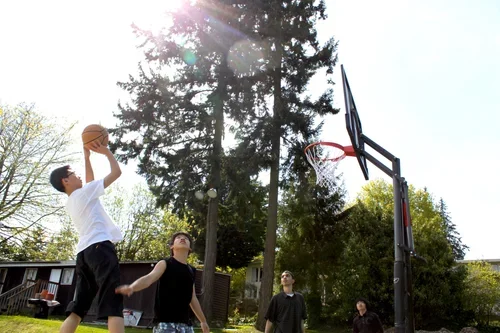 Solomon International School students playing basketball