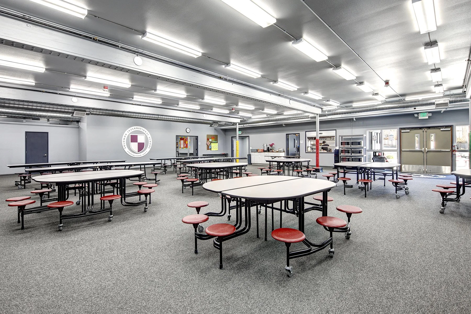 Solomon International School commons with the school crest
