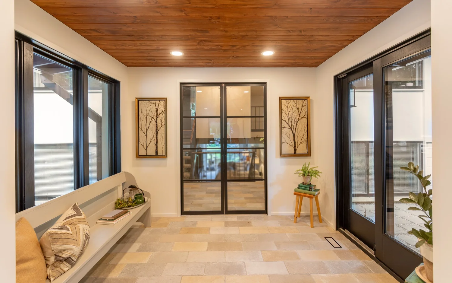Entryway in a whole-house remodel by Veritas Custom Homes