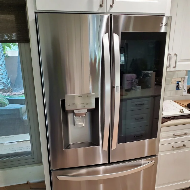 French-door refrigerator set in place in a Phoenix kitchen