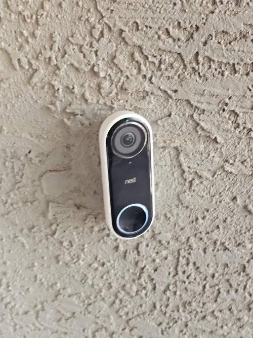 Video doorbell installed on a stucco wall in Phoenix