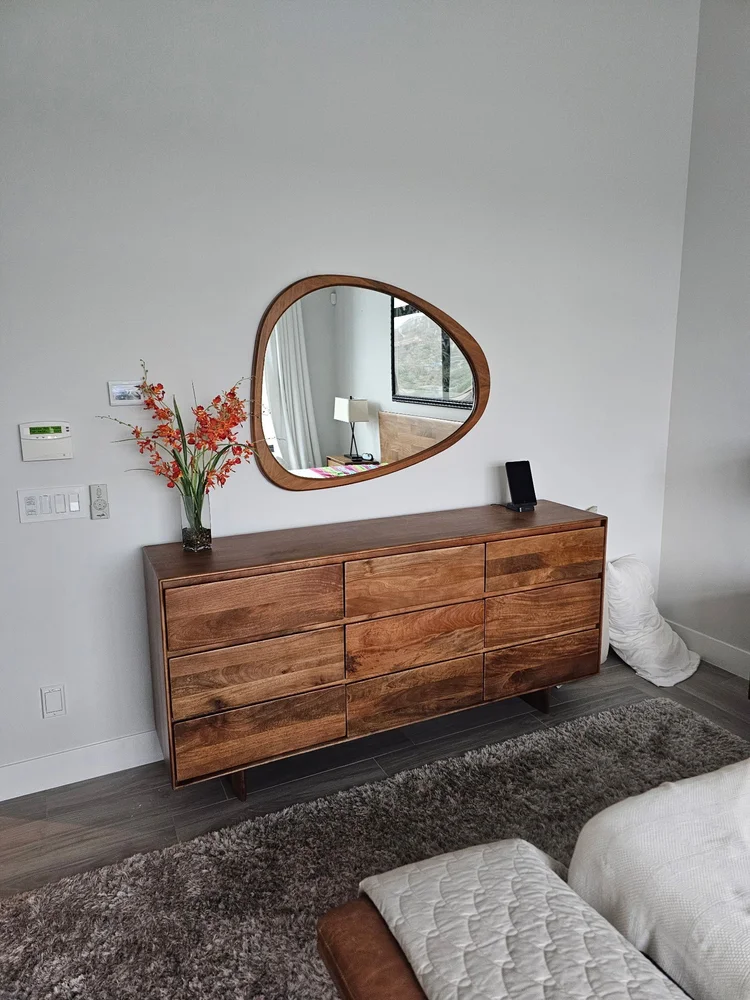 Dresser styled and mirror hung in a Phoenix guest bedroom