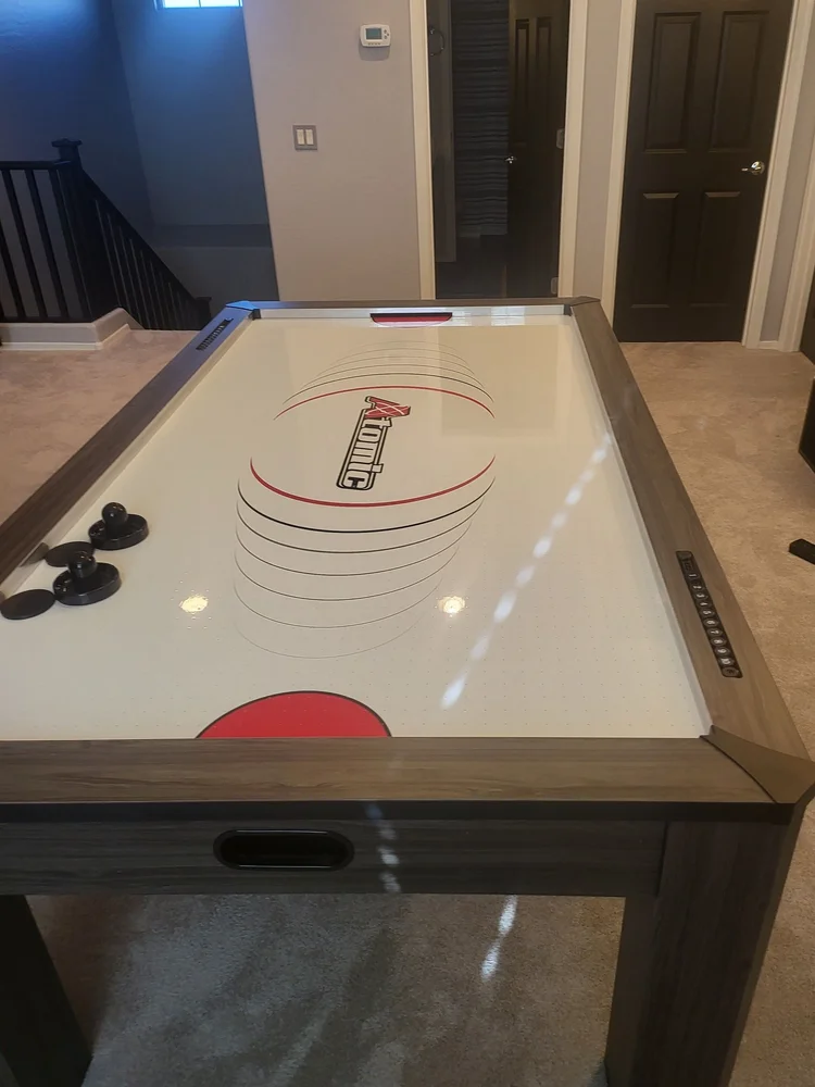 Air hockey table set up in a Phoenix home game loft