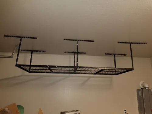 Overhead garage storage rack installed on a Phoenix garage ceiling