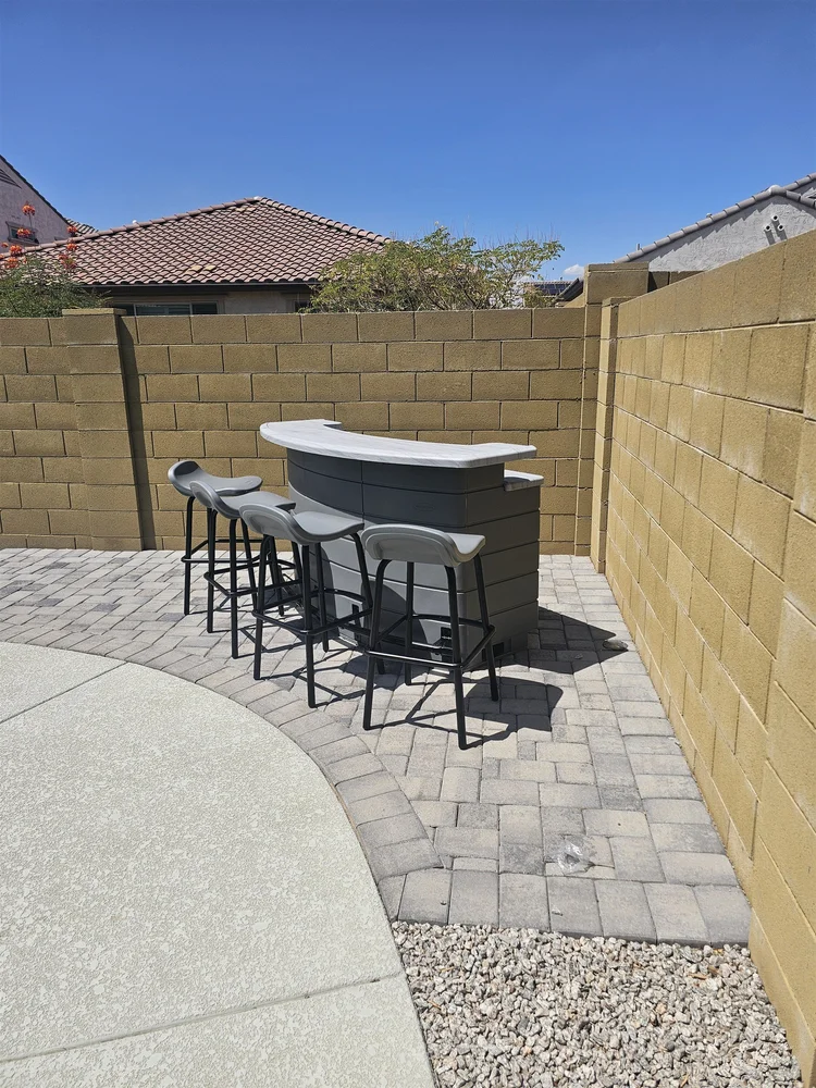 Outdoor bar and stools assembled in a Phoenix backyard rental