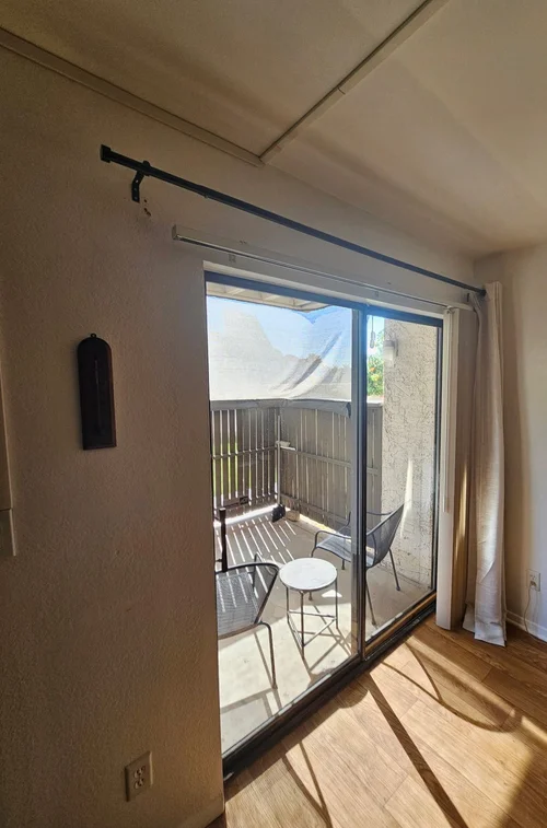 Curtain rod installed over a sliding patio door in Phoenix