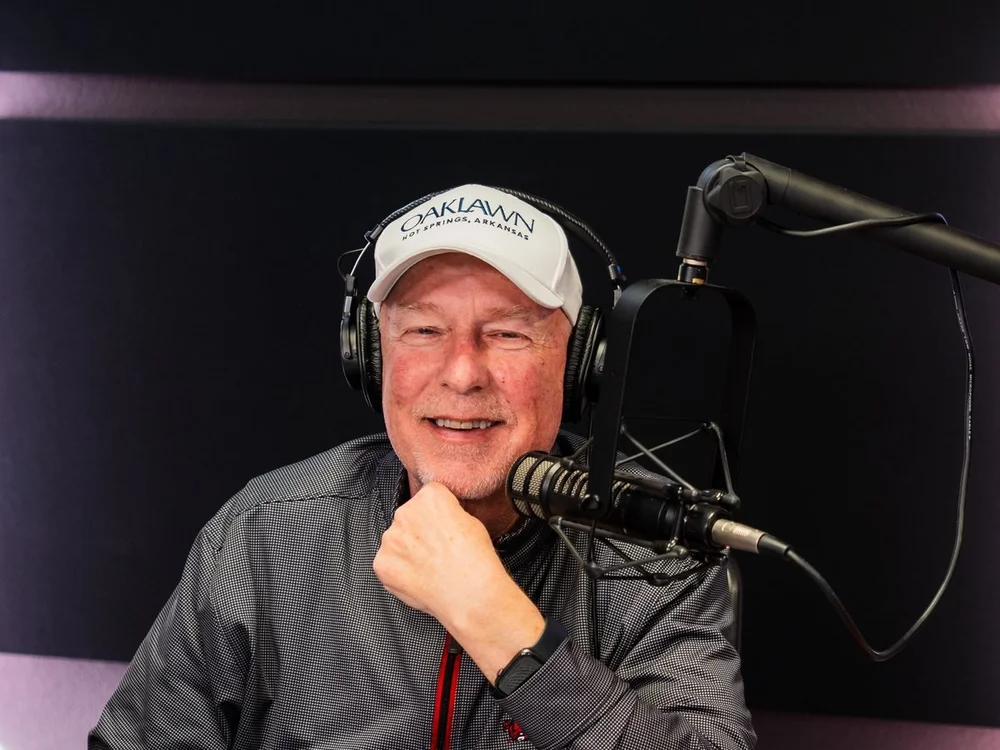 Chuck Barrett, voice of the Razorbacks, at the mic in the Chuck & Bo Show studio