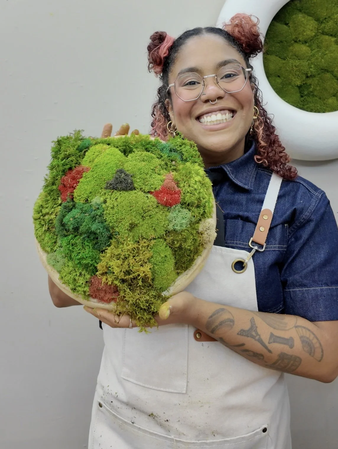 Finished moss bowl held up after class
