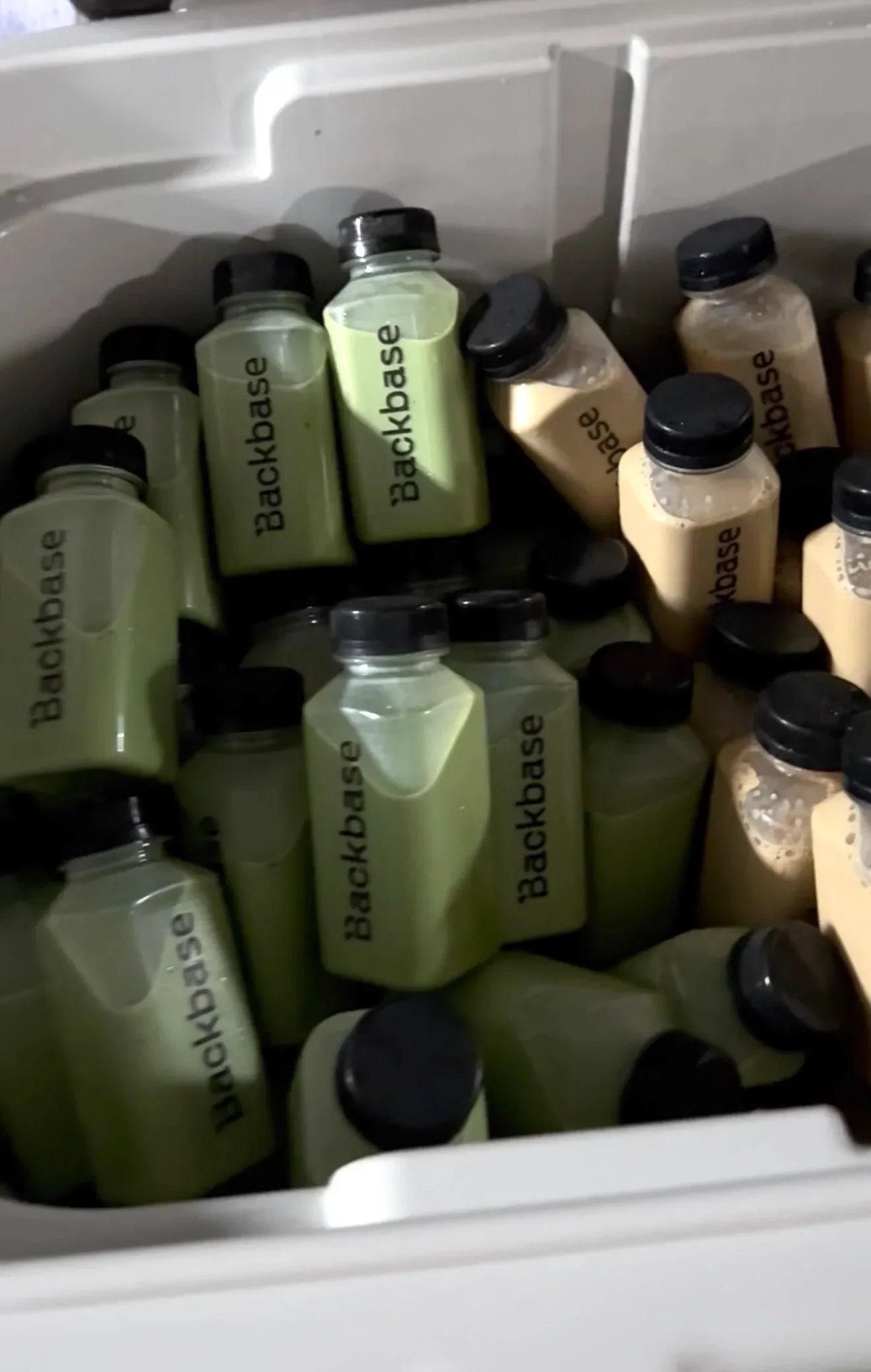 Backbase branded bottled drinks chilling in a cooler for a corporate brand activation in Orange County
