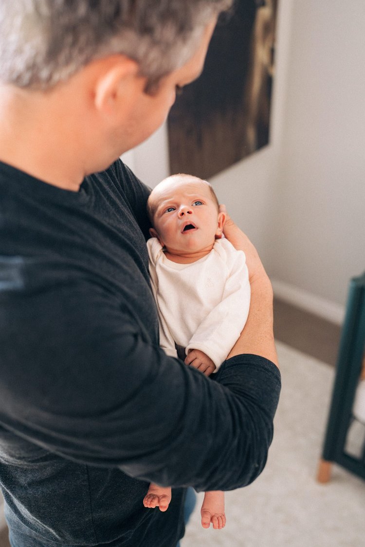 A moment from the Hunter family's in-home newborn session in Rancho Mission Viejo