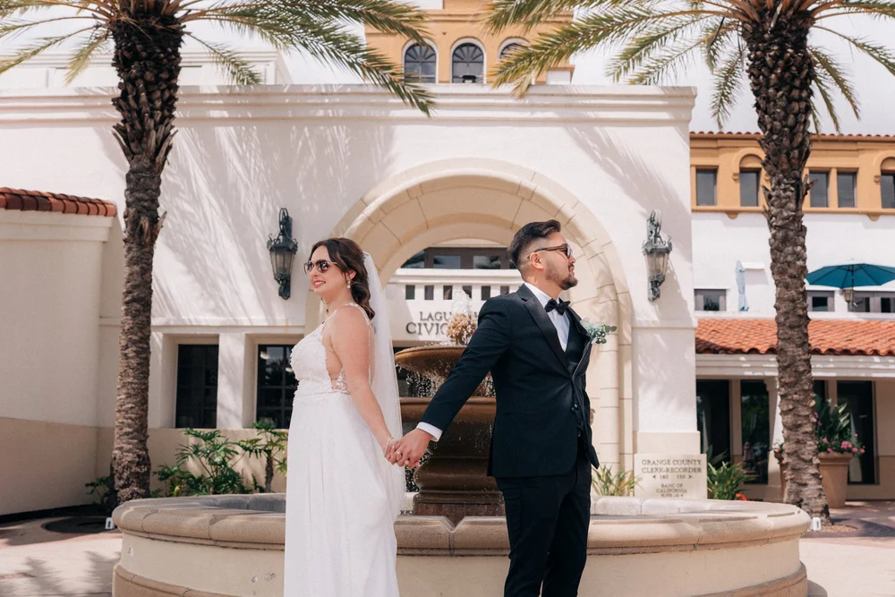 Jessica and Alex in front of the Laguna Hills Civic Center on their wedding day