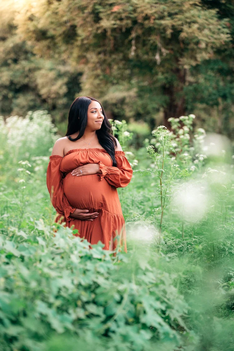 An expecting couple at golden hour during a maternity session in Orange County