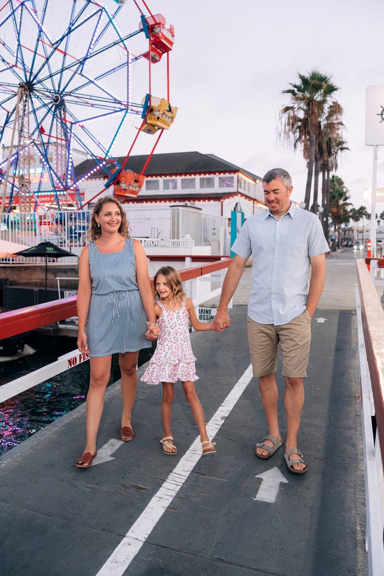 A family walking together on the boardwalk during a storytelling session