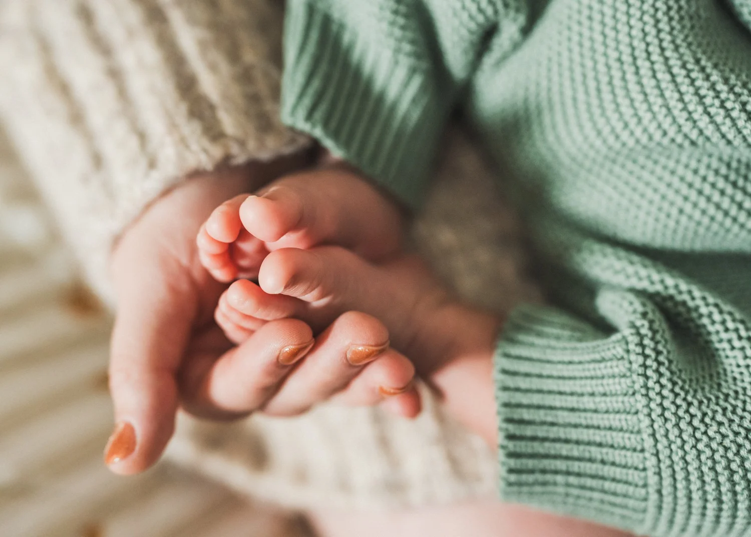 A moment from Nathan and Ana's in-home newborn session in San Diego
