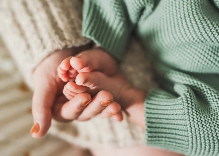 A moment from Nathan and Ana's in-home newborn session in San Diego