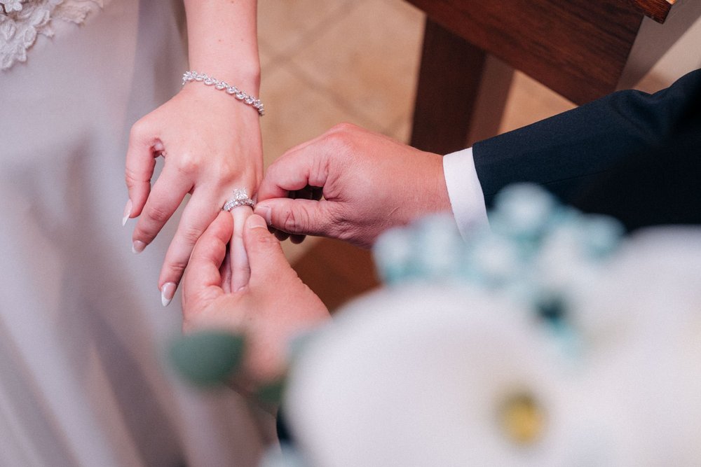 A close-up of the ring going on