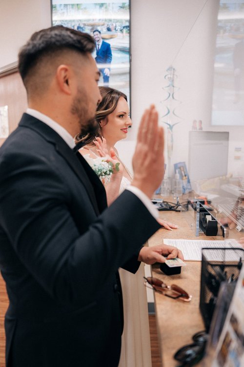 Jessica and Alex signing the marriage license