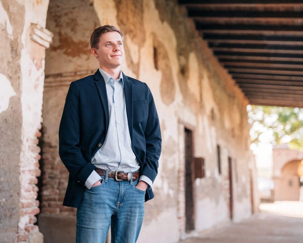 A senior during a Main Character session at golden hour