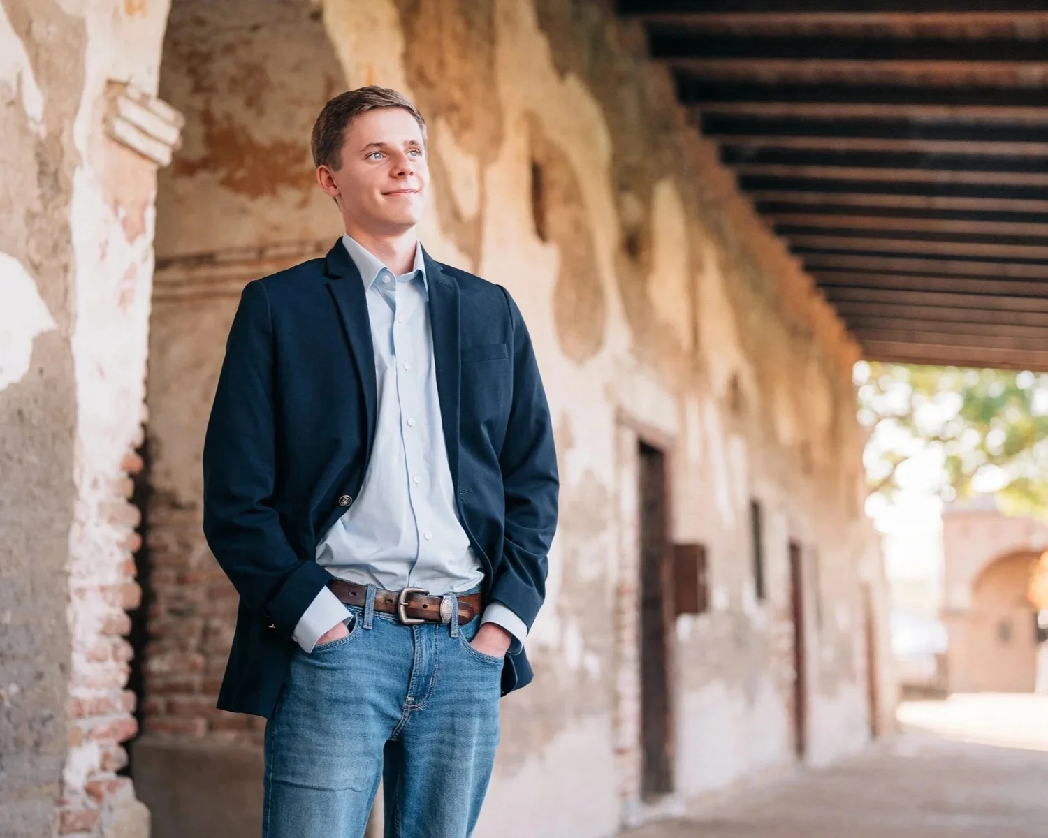 A senior during a Main Character session at golden hour