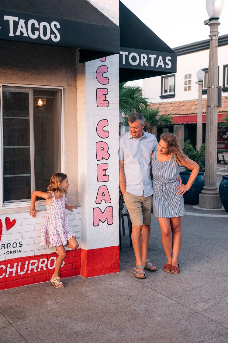A family outside an ice cream shop on Balboa Island during a storytelling session