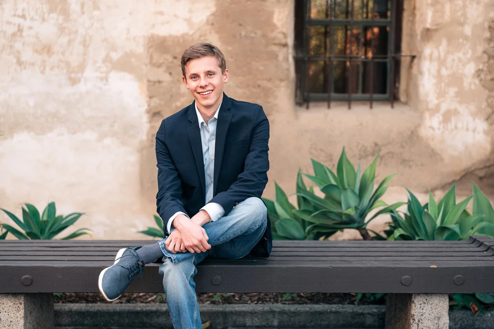 Christian on the bench at Mission San Juan Capistrano