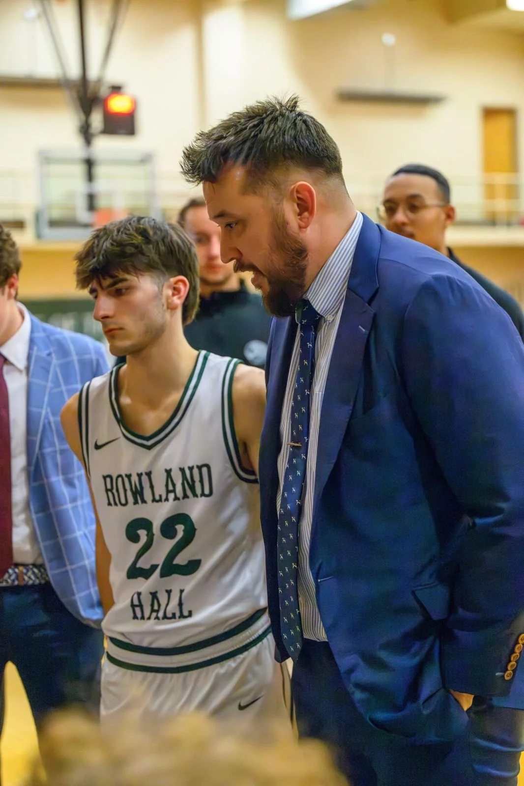 Coach Zack Alvidrez in the huddle