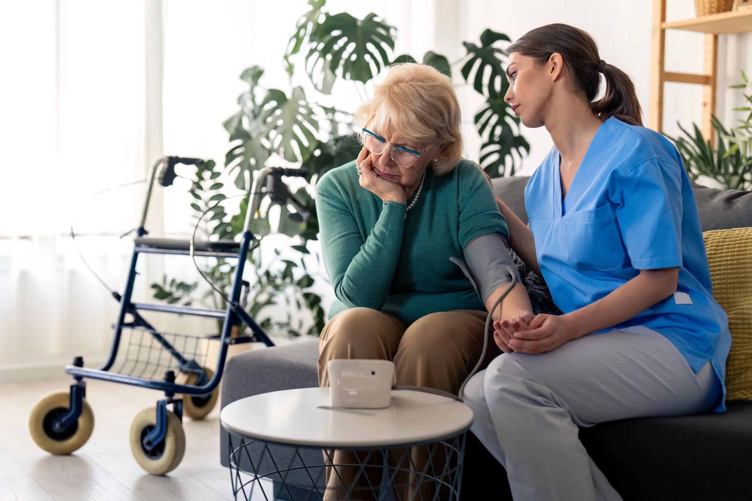 Care professional supporting a senior at home