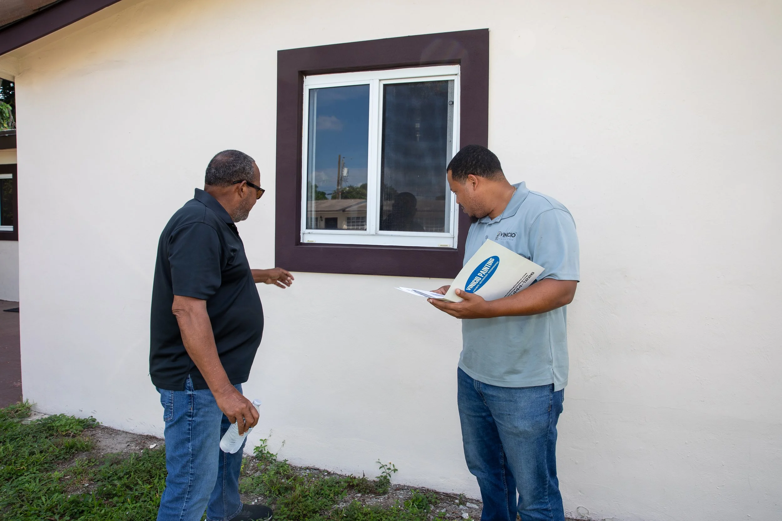 Yohan Nunez reviewing an estimate with a customer