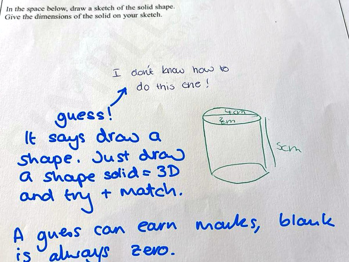 GCSE maths answer with handwritten examiner feedback and a sketch showing how to attempt a solid-shape question