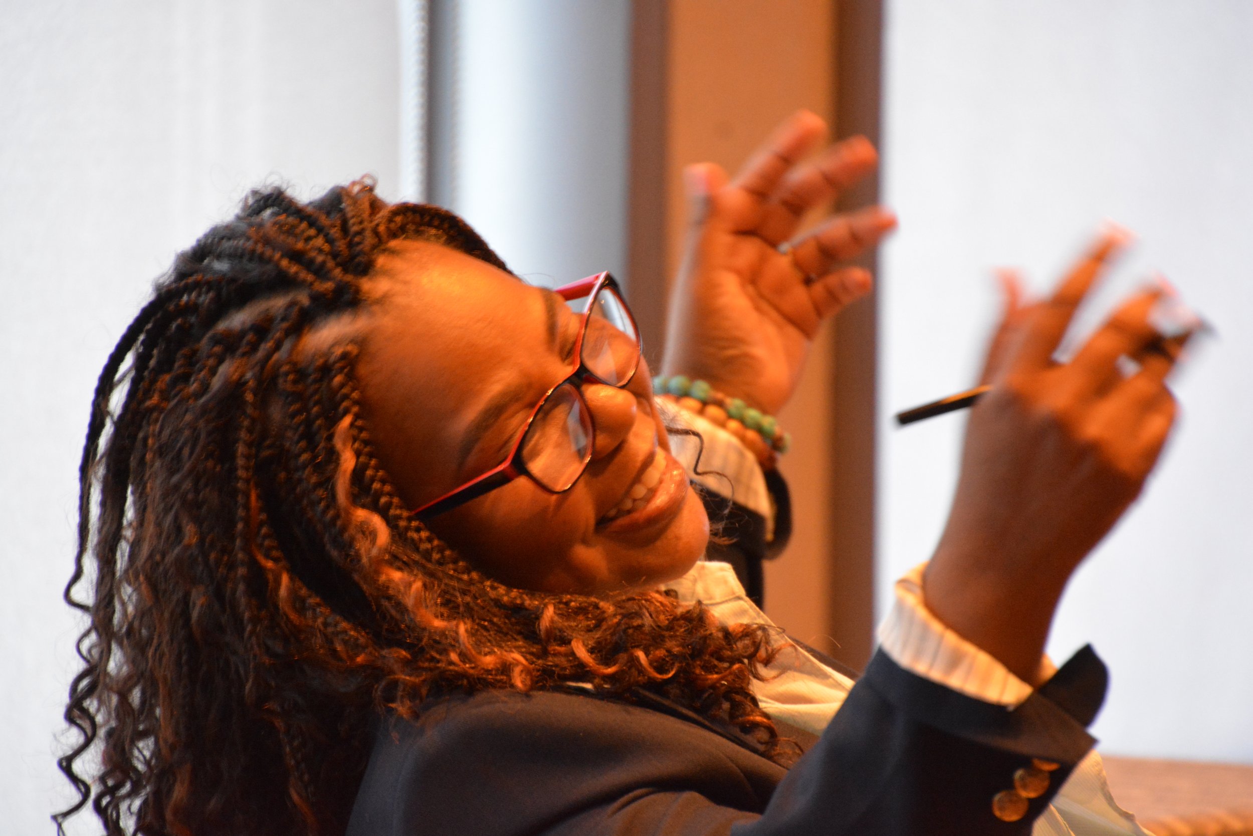 Angelique Cauthorn in conversation at a conference