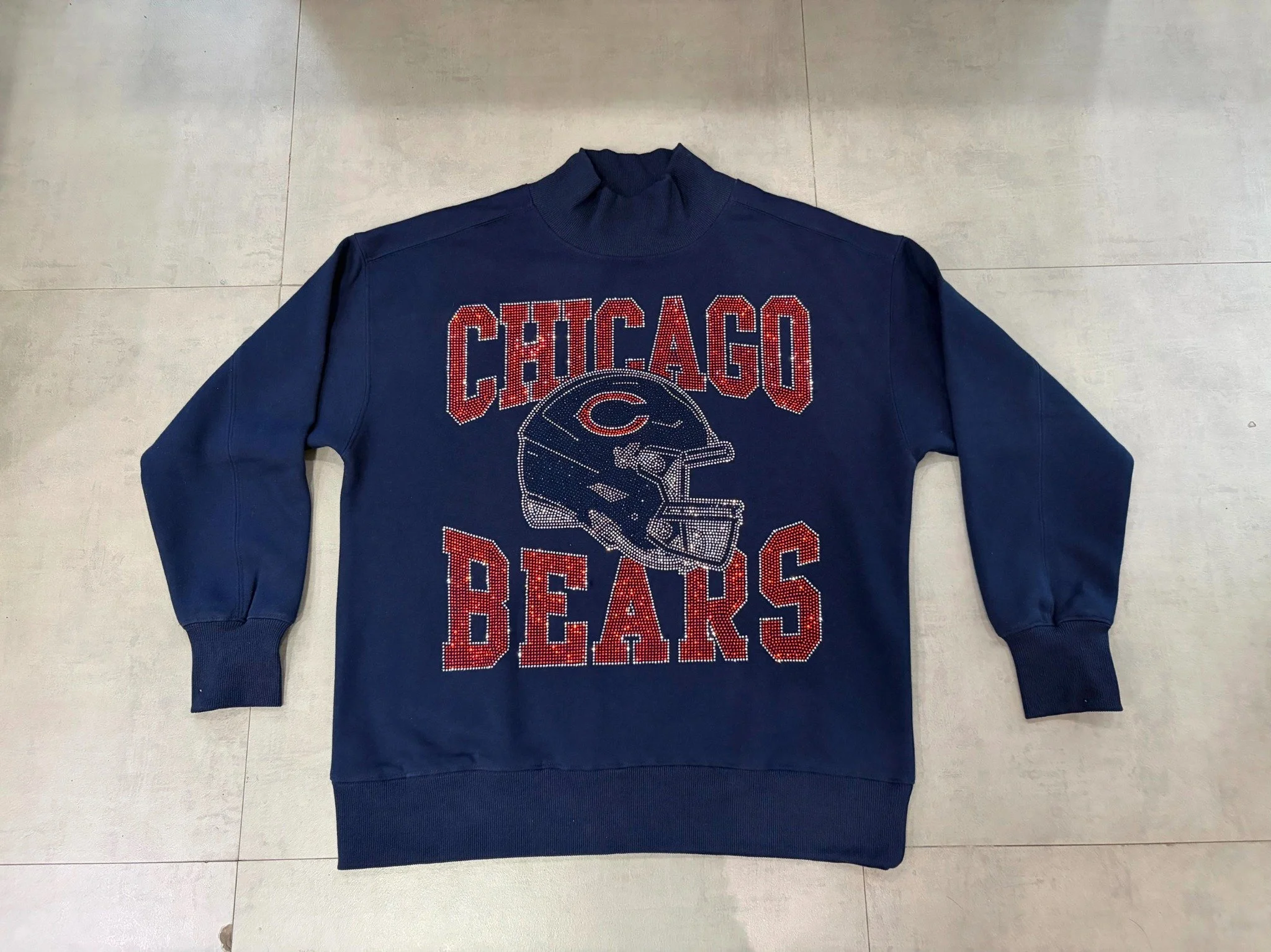 Navy mock-neck sweatshirt sample with Chicago Bears lettering and a football helmet graphic