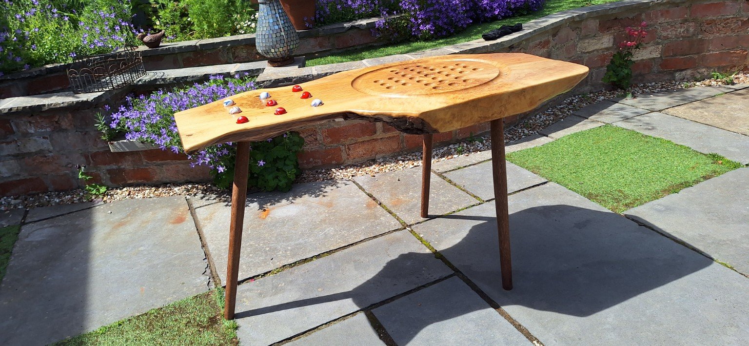 Oakline natural-edged games table with marble game positions
