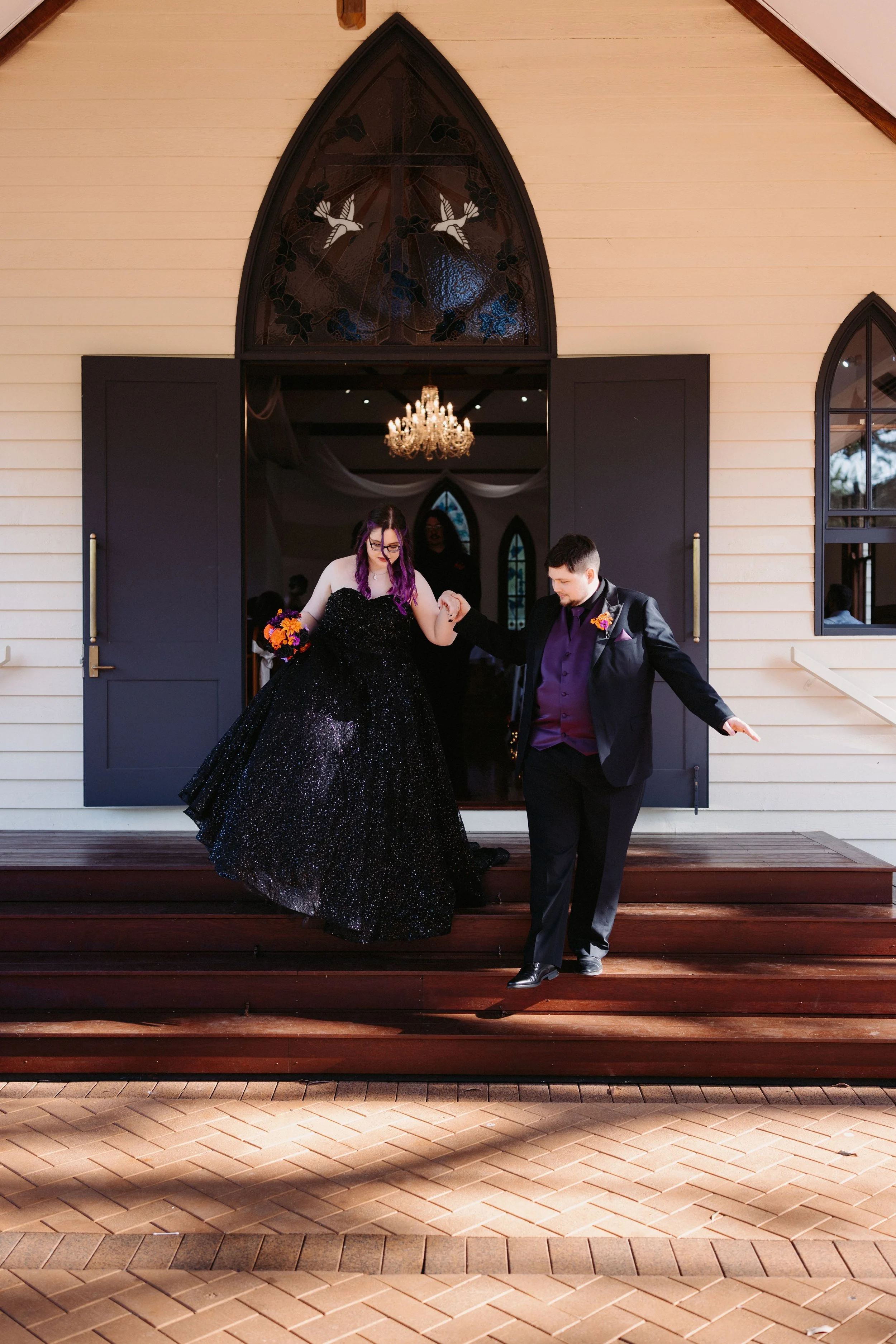 Chantel and Baylee leaving the chapel together at Shambala Estate.