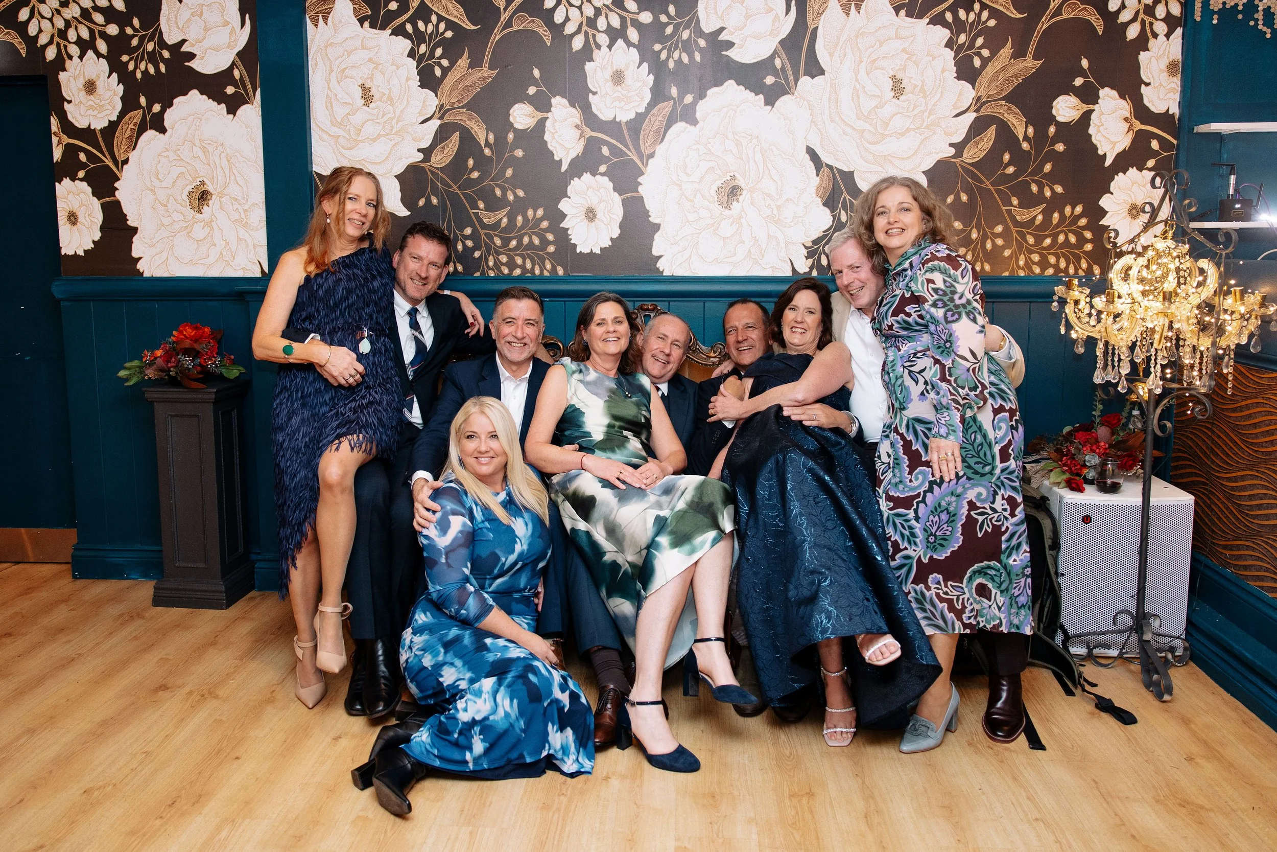 Wedding guests gathered for a group photograph inside Shambala Estate
