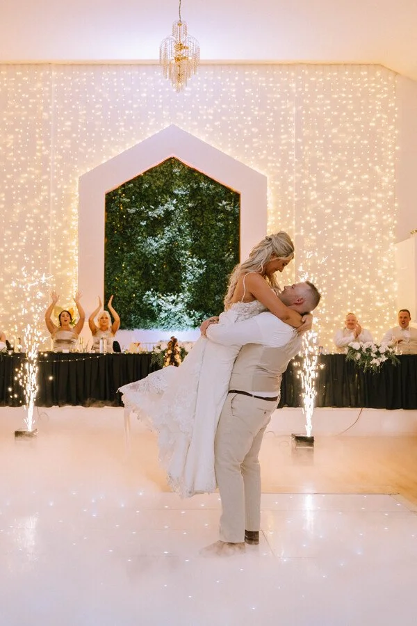 A newlywed couple celebrating together inside the Shambala Estate Chapel.