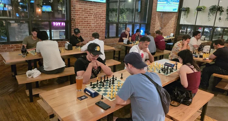 Players enjoying Pub Chess Liberty at Left Field Brewery