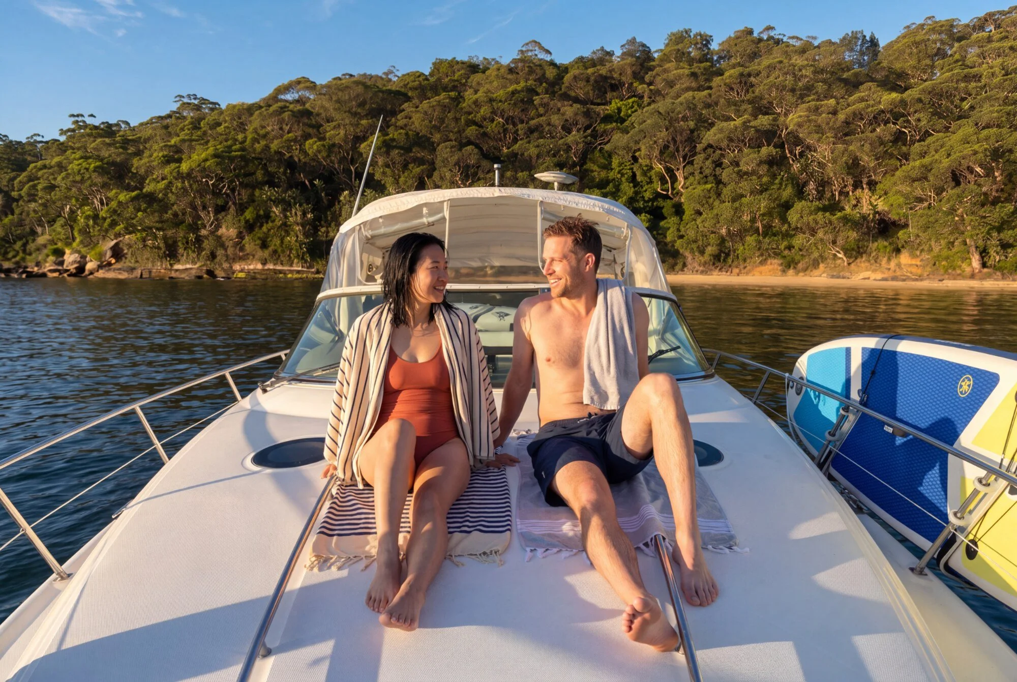 Couple relaxing on Opal at a quiet anchorage