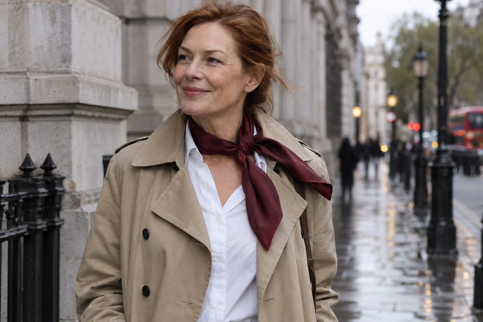 Editorial illustration of a woman wearing an unbranded burgundy silk scarf and sandstone trench in London