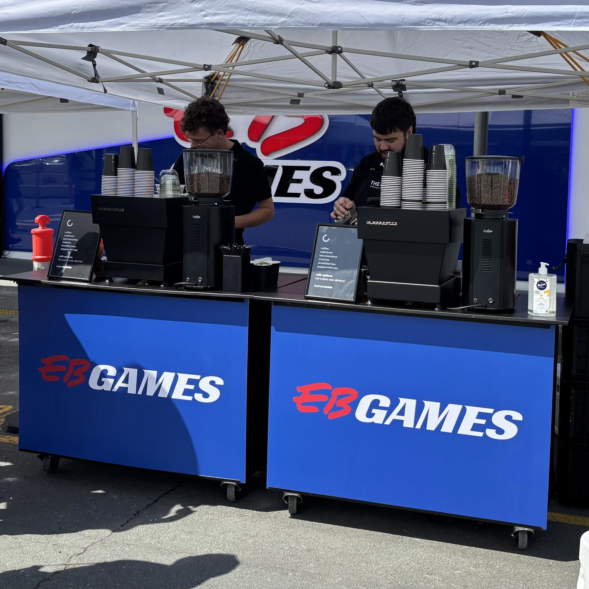 Coffee cart with custom company branding at a Brisbane activation