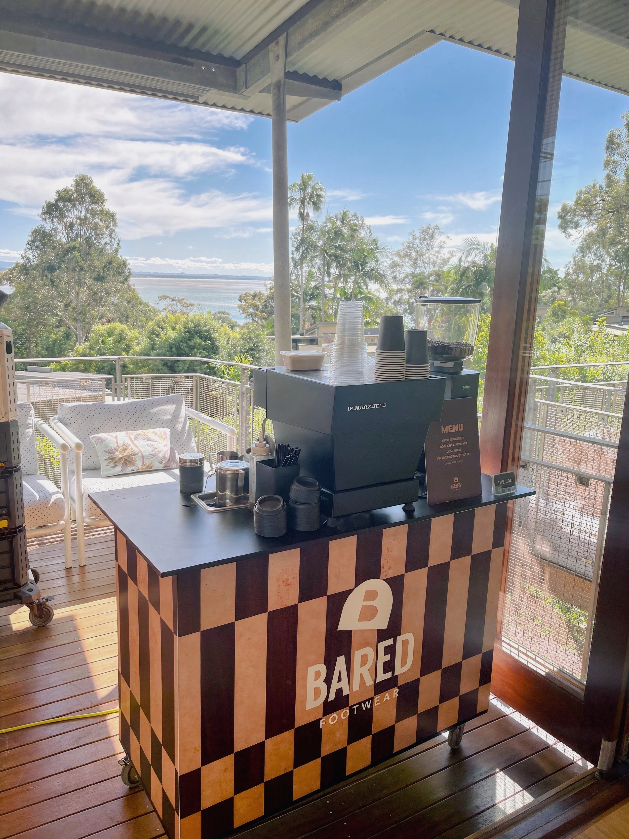 Custom branded coffee cart panel and cup sleeve