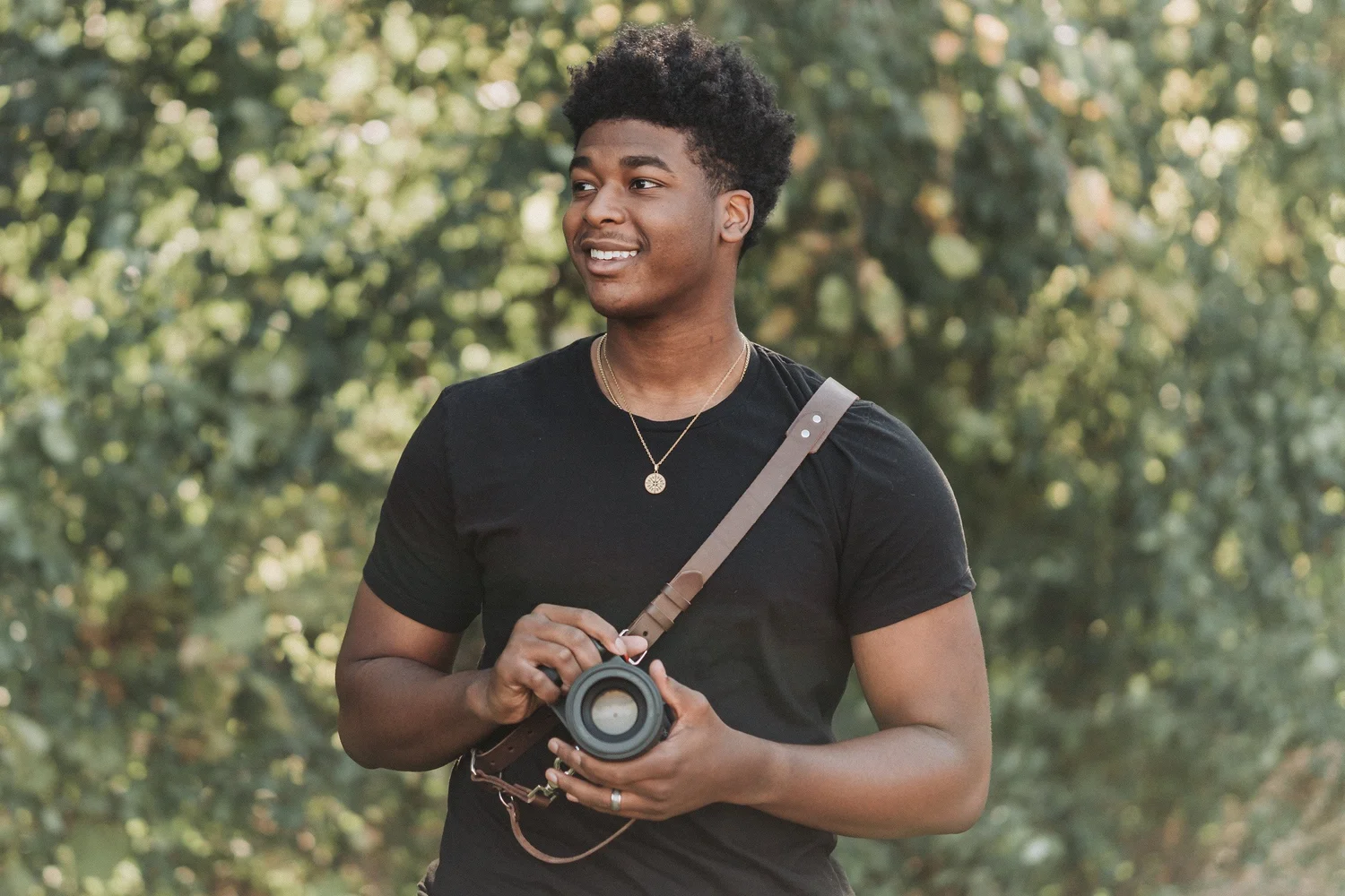 Dwayne Durant holding his camera