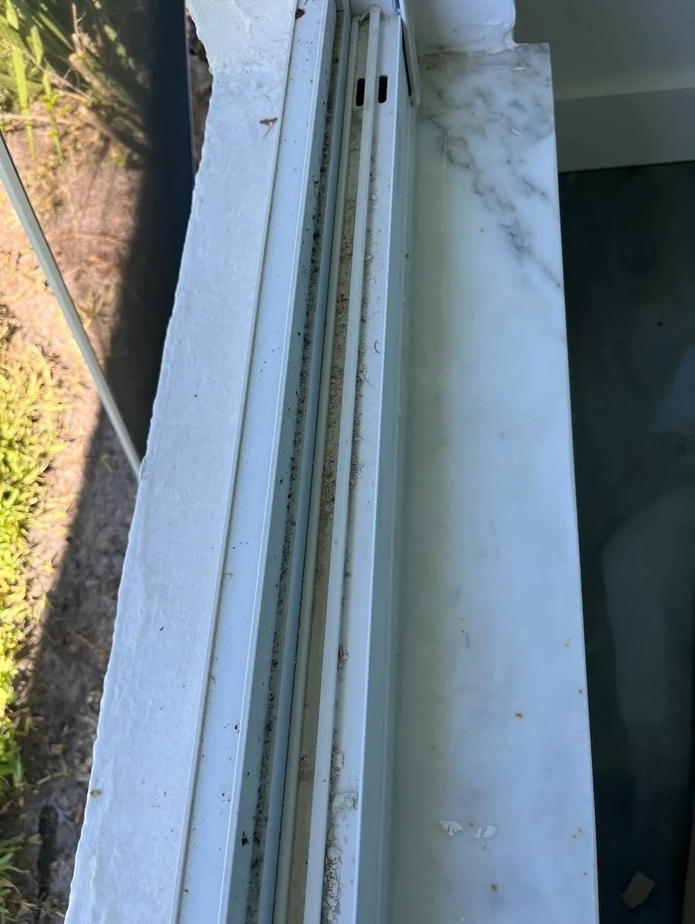 Window Track Before Cleaning in Naples, FL