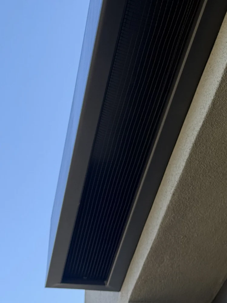 Custom bird exclusion mesh fitted beneath a roof overhang