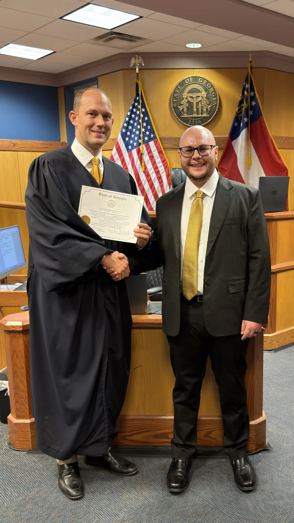 Isaac A. Mazur with the presiding judge after his swearing-in at Fulton County Superior Court on September 18, 2026