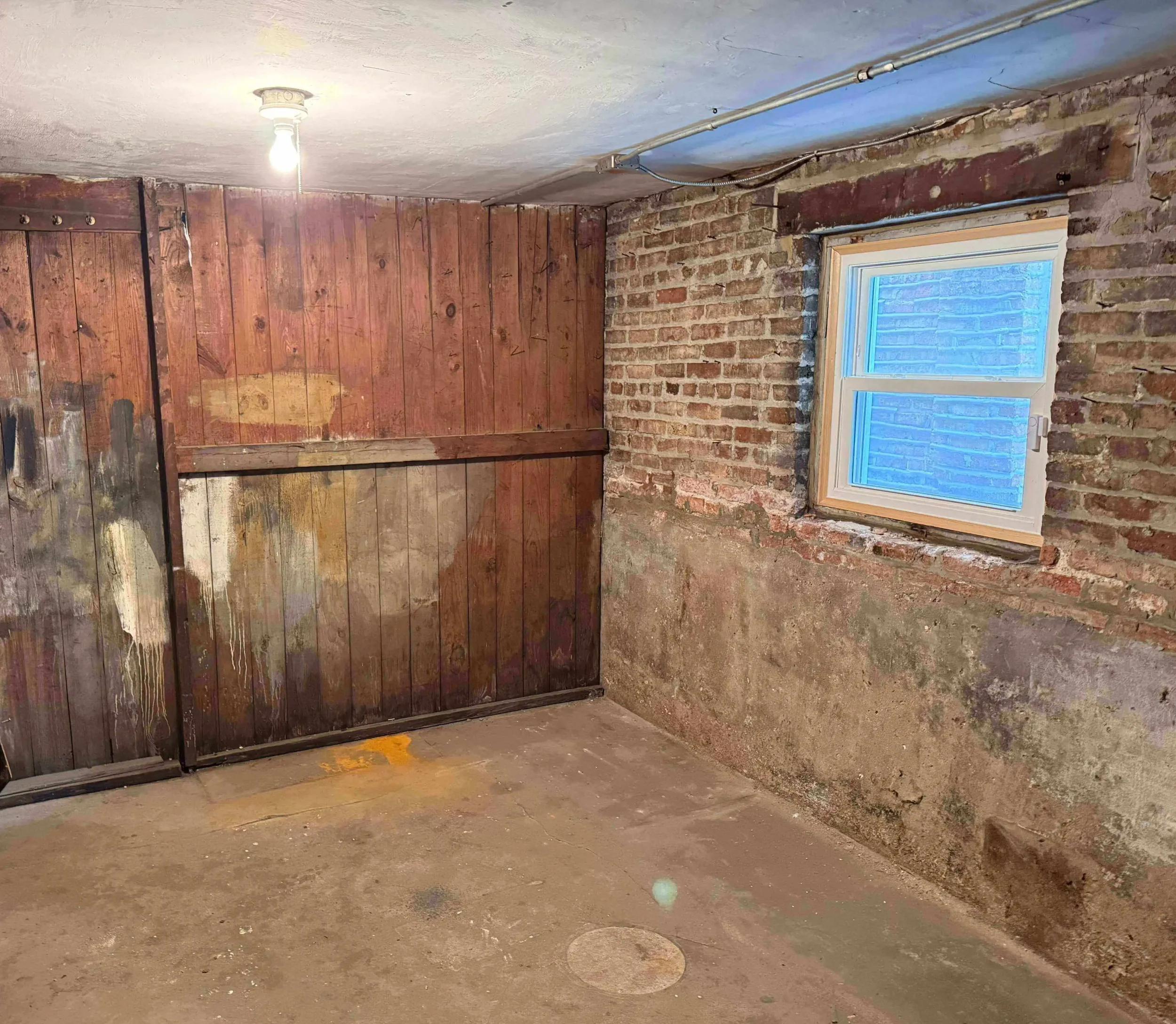 Completely cleared and spacious basement area in Cicero, IL after hauling services.