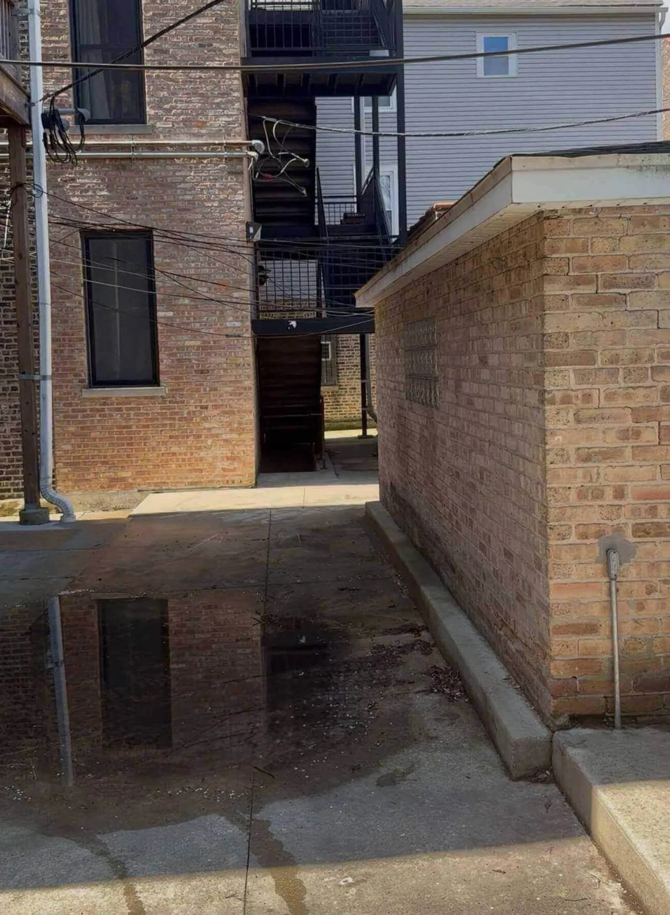 Cleaned residential area in Chicago, IL after professional cabinet and sink hauling.
