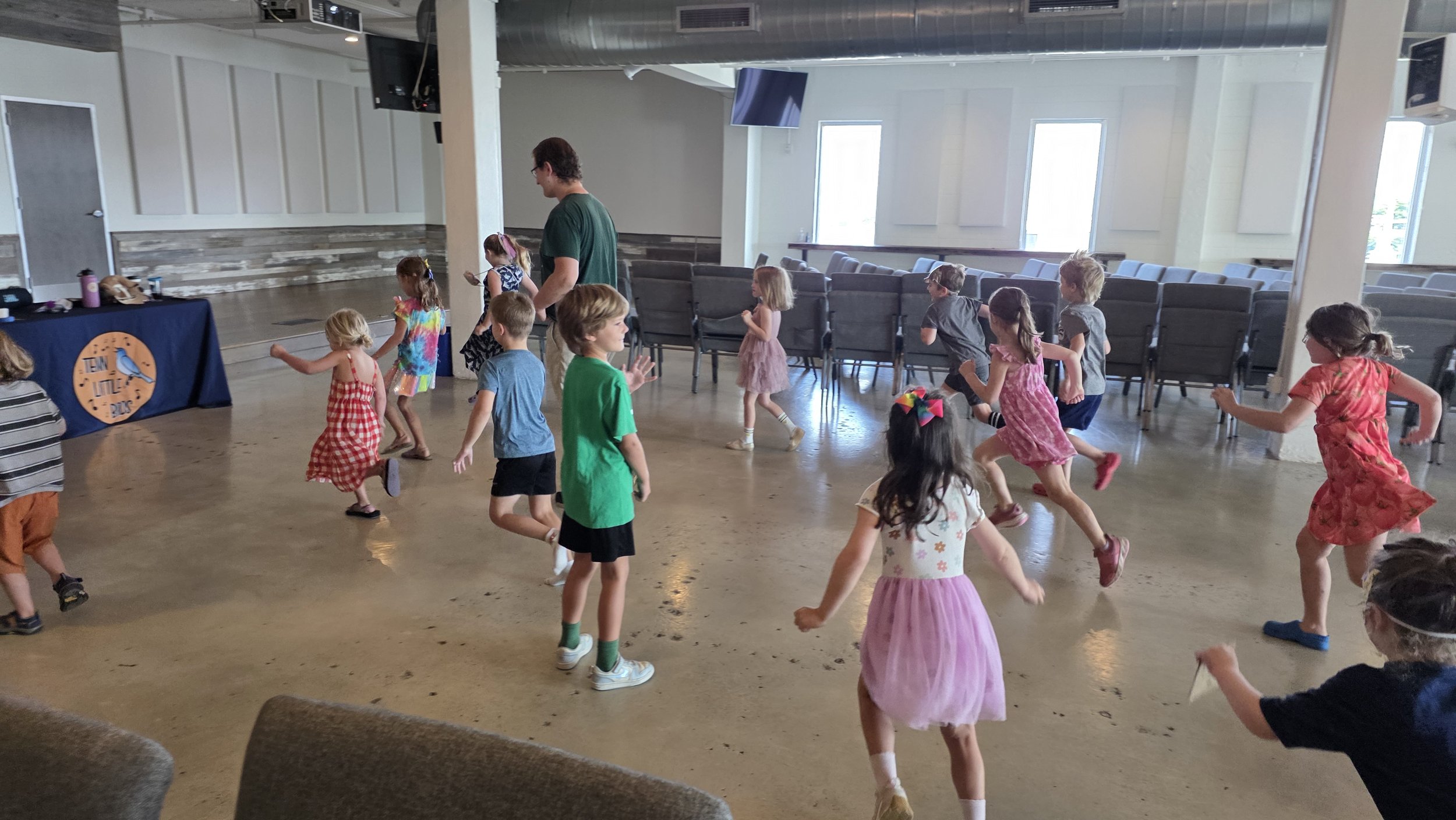 Children moving together in the large studio at EAST Collective