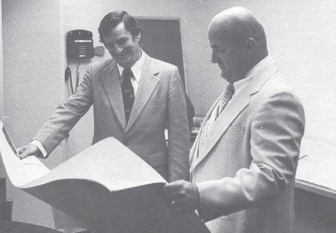 Gill Barnett reviewing plans in the early days of PCI — circa 1970s