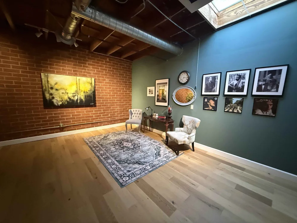 A home living room set up for an in-home guitar lesson